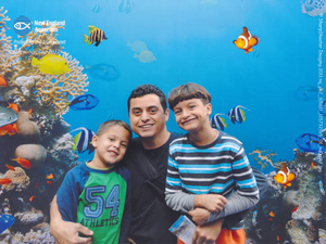 Dad and boys at the aquarium
