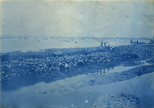 [Men working on unidentified seawall]