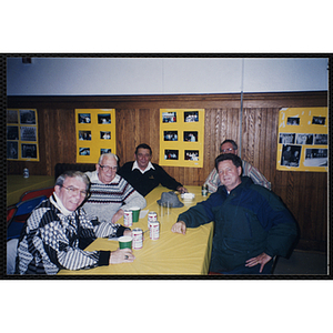 Five Bunker Hillbilly alumni sit at a table during a reunion event
