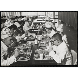 Members of the Tom Pappas Chefs' Club eat lunch in a Brandeis University dining hall