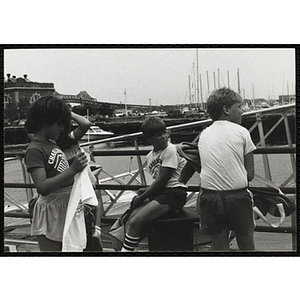 A Small group of boys and girls waiting on the pier at the Charlestown Navy Yard