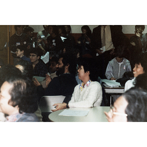 Community members listen to a performance at a Chinese Progressive Association event