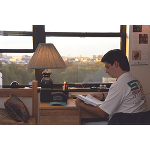 A student studying in his dorm room