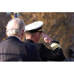 Two men face away from the camera at the Veterans Memorial dedication