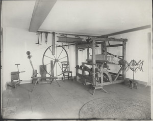 Interior view of the Royall House, showing a loom and spinning wheel, Medford, Mass., undated