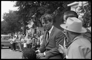 Robert F. Kennedy talking with members of the public at the Turkey Day parade