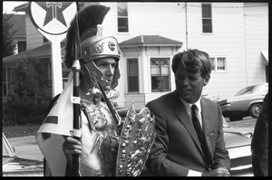 Robert F. Kennedy with a high school student in Trojan costume at the Turkey Day parade