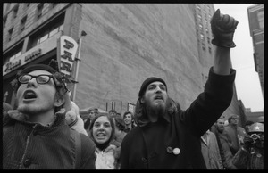 Two anti-Vietnam War protesters raise their fists during the Counter-inaugural demonstrations, 1969