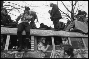 Riders atop the psychedelic bus 'The Road Trip' during the Counter-inaugural demonstrations, 1969