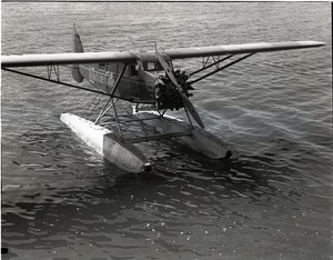 William Wincapaw's floatplane on the water (note La Touraine Coffee advertisement on side)