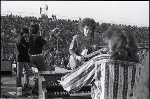 Hollywood Speedway Rock Festival: Elvin Bishop Group in performance: Elvin Bishop playing to keyboardist Steve Miller (Jo Baker in background)