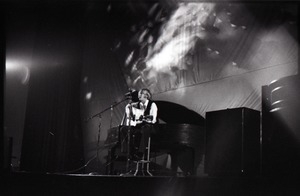 Unidentified female twelve-string guitar player in concert