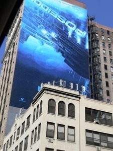 Poster advertising the Poseidon (film) plastered on a building