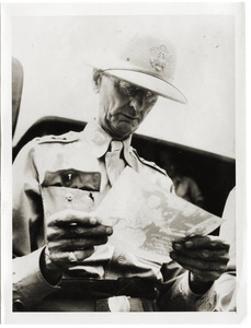 Gen. Wainwright looking at radio=photo picture of his wife