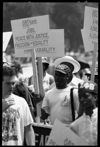 Black fraternity members (Phi Beta Sigma) carry signs for 'Jobs, Peace with Justice, Freedom and Equality,' 25th Anniversary of the March on Washington