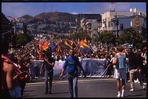 Massive crowd with pride flags marching in the San Francisco Pride Parade