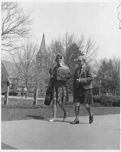 Hugh MacDiarmid, walking with female student in front of the old chapel