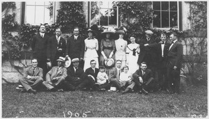 Members of the class of 1905 and others standing and sitting in front of Old Chapel
