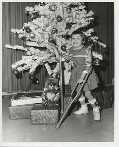 Young girl with Christmas tree