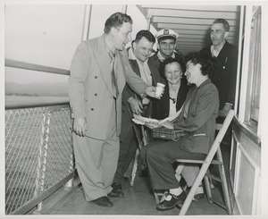 Men and women talking during annual boat ride