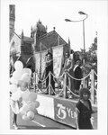 Suffolk University's 75th Anniversary Float processing down Boylston Street, photograph, 9/21/1980