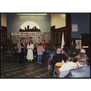 A girl receives an award in the MADD 1991 Poster and Essay Contest