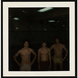 Three Boys' Club members pose in swimming trunks