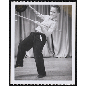 A boy dancing with top hat and cane at the Roxbury Boys' Club Talent Show