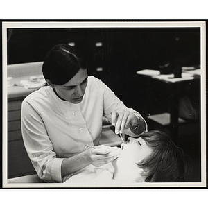 A boy receives a dental exam