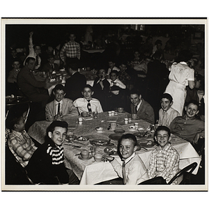 Boys' Club members seated around a table at an awards event