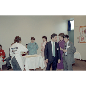 People chatting and talking at a food tasting event