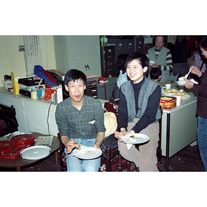 Guests eating at an International Women's Day event