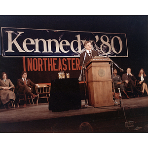 Senator Edward Kennedy speaks at a podium during the Kennedy "80" campaign at Northeastern University