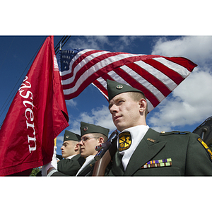 ROTC cadets carrying flags at the groundbreaking of the George J. Kostas Research Institute for Homeland Security