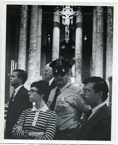 James Forest (right), later arrested with the Milwaukee 14, and 2 others with a policeman inside of St. John's Cathedral after the eight people had been arrested