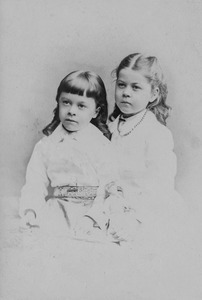 Harry (right) and Frances Foote, the twins: studio portrait, vignetted