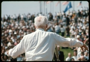 Norman Thomas addressing the crowd at an anti-Vietnam War demonstration: view from the rear of the stage