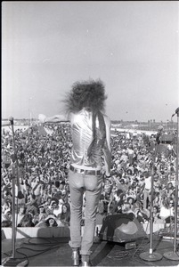 Hollywood Speedway Rock Festival: Wet Willie in performance, Jimmy Hall (vocals) at edge of stage, from behind