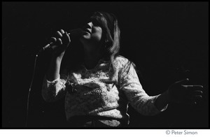 Fairfax Street Choir performing on last night of the Kohoutek Celebration of Consciousness: close-up of woman singer