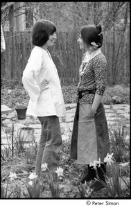 Ram Dass retreat at David McClelland's: two women talking in a garden