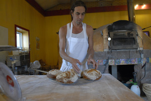 Hungry Ghost Bread: owner and baker Jonathan C. Stevens with fresh-baked bread