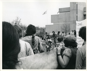 Board of Trustees fee increase demonstration: protestor speaking in front of Whitmore Administration Building