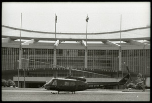 May Day concert and demonstrations: army Huey helicopter on ground in front of Robert F. Kennedy Stadium