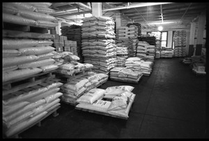 Palettes loaded with sacks of kasha, sea salt, and other goods at Erewhon Trading Company