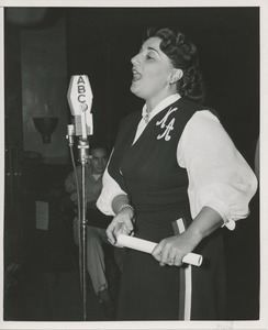 Woman speaking into microphone