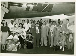 The Harlem Globetrotters under a TWA airplane, 1952