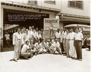 Harlem Globetrotters at the La Perla Cigar and Cigarette Factory in Paranaque, Philippines on September 3, 1952