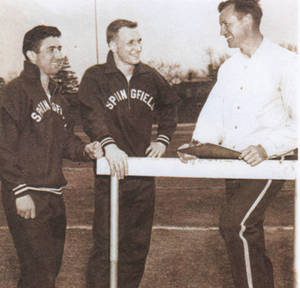 Coach Cox, Tom Waddell and Jack Savoia on a sports field