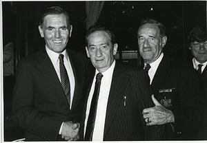 Mayor Raymond L. Flynn with three unidentified men