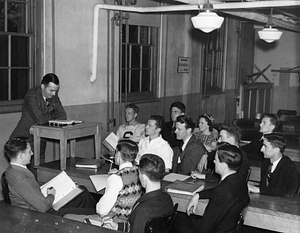 Professor lecturing to class from the 1950's